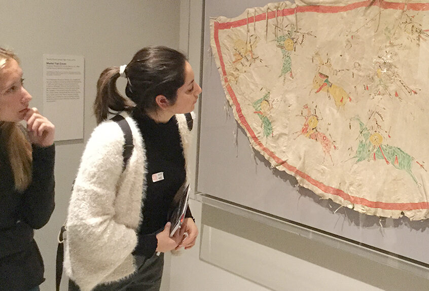 US AP History at MET for Art of Native American exhibit students take a close look at fabric