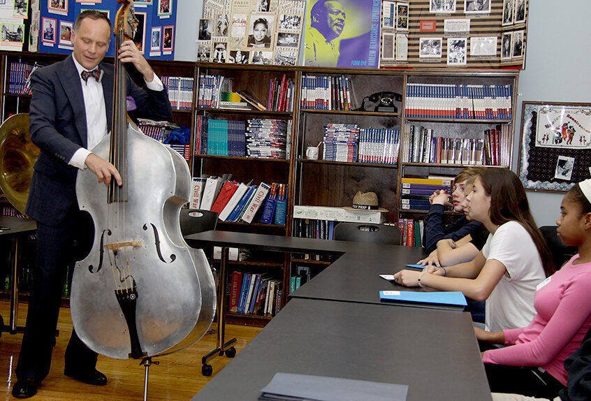 Middle School Harlem Renaissance project guest musician playing standup bass