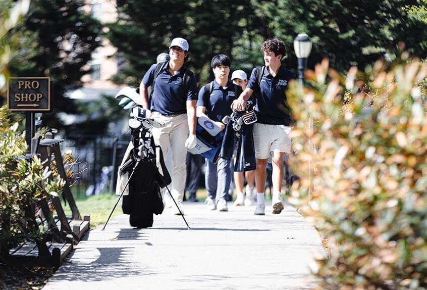 Poly golf team walking to the course