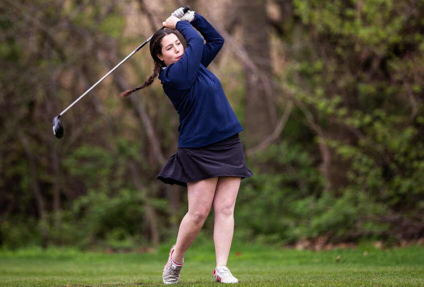 Poly Prep Golf team Athlete swings the golf club