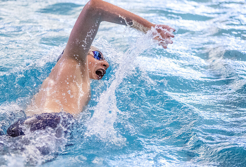 Boys swimmer racing