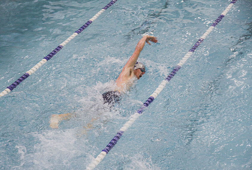 Boy swimmer racing