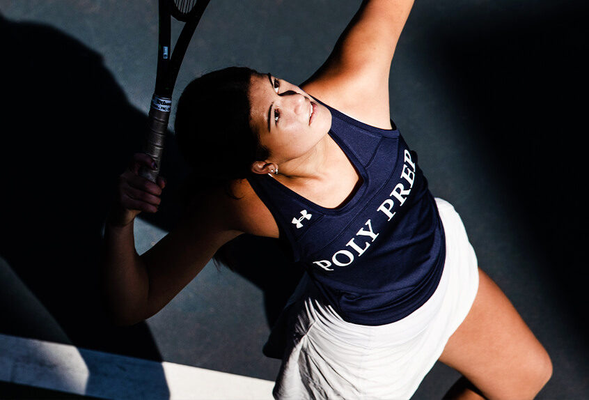 Girls Tennis player hitting the tennis ball