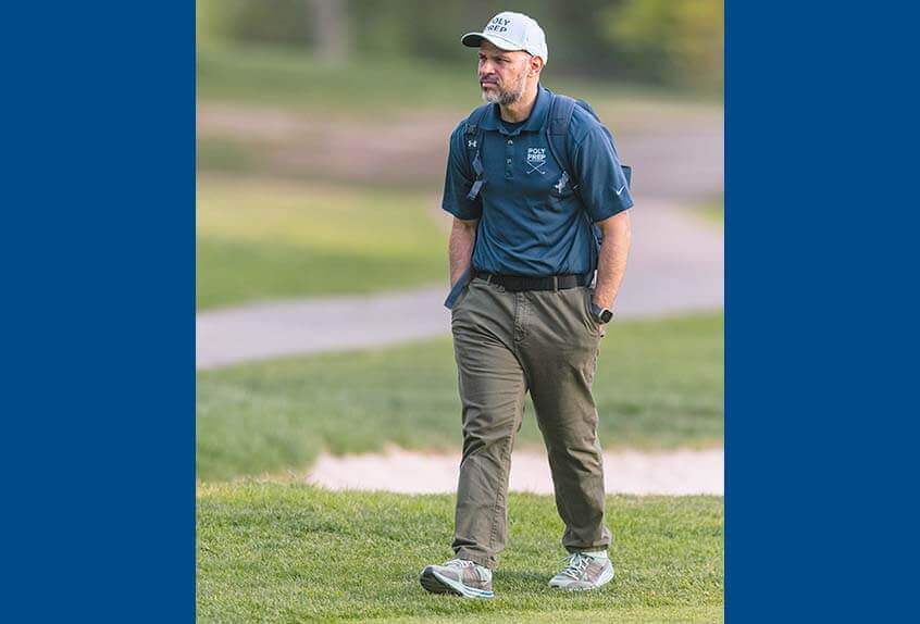 Head Golf Coach Dr. Alex Carter on the green