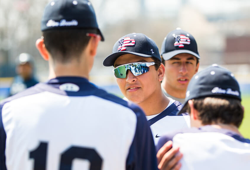 Poly Prep Baseball athletes in a team meeting