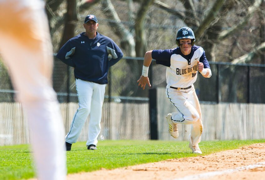 Poly Prep baseball athlete running for the base