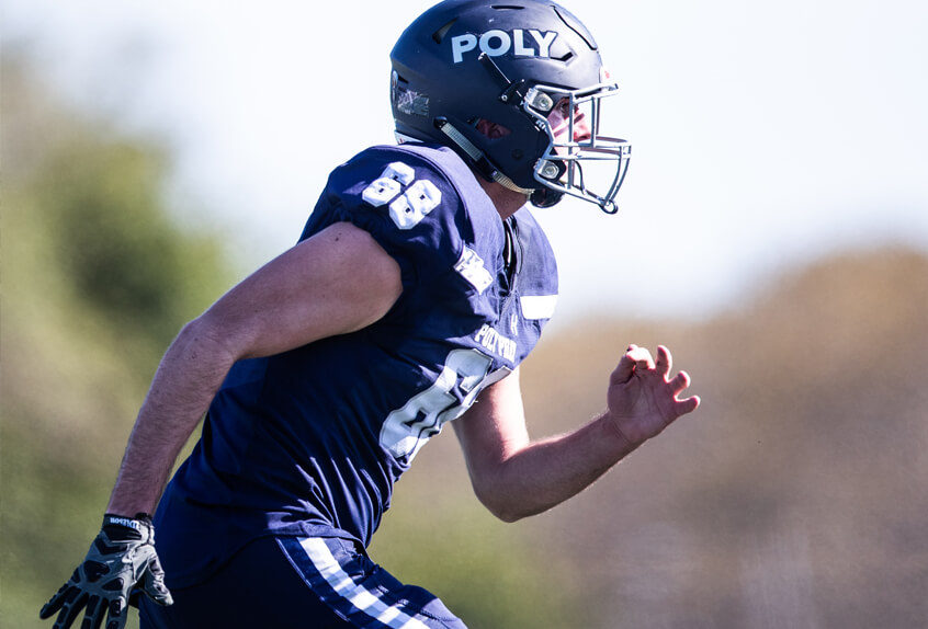 Poly Prep Varsity Team football player running