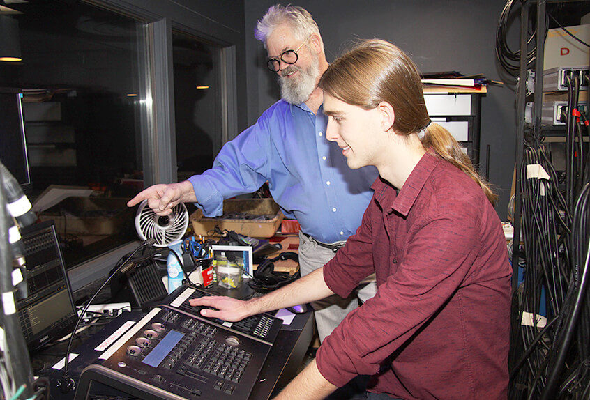 Students learn about lighting in the theater