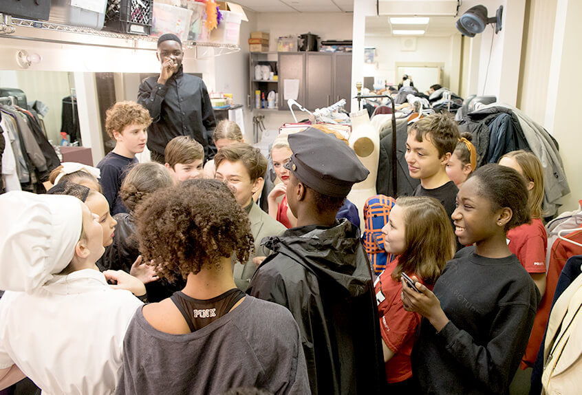 Middle school students excited to go on stage for play Clue