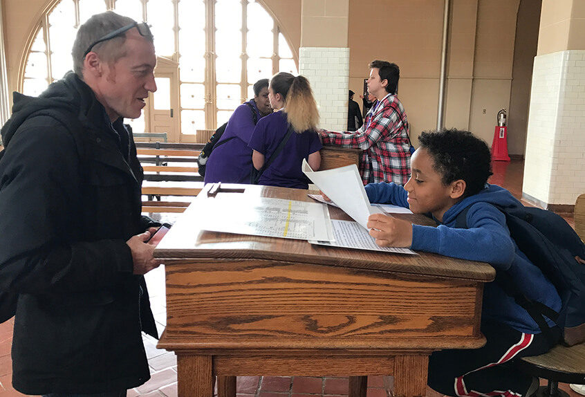 Lower School Student and Teacher interacting at a Museum