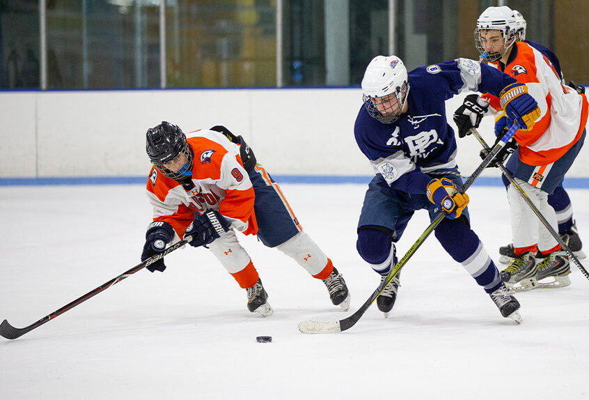 Poly Prep students playing hockey