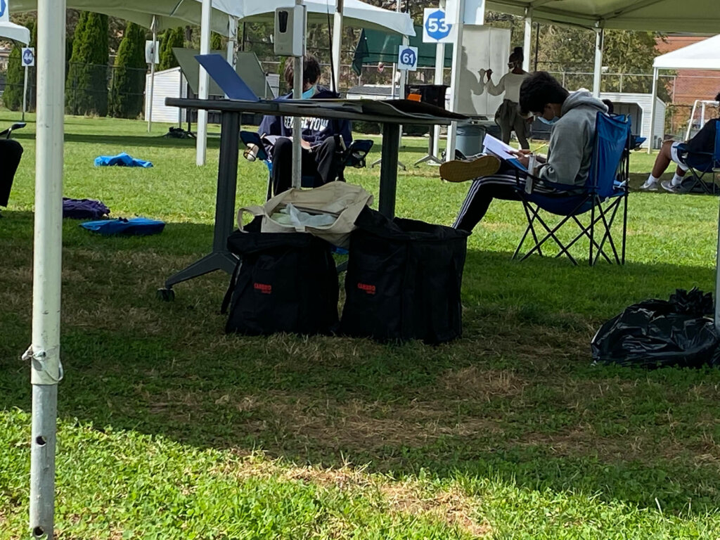 Boys studying under tent by Josiah Bartholomew23