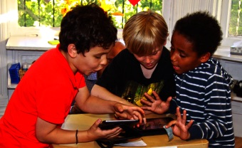 Admissions Lower School students looking at screen