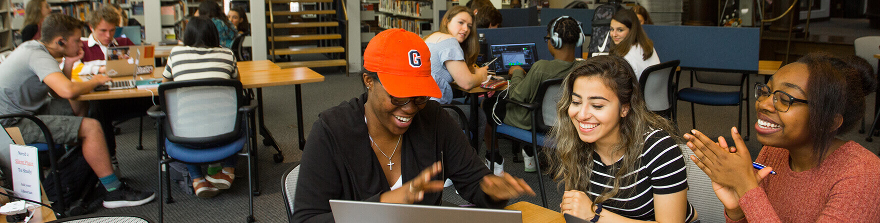 Admissions Upper School students working together in library