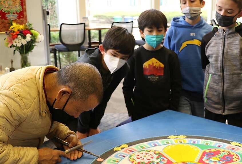 Lama Tenzin working on mandala