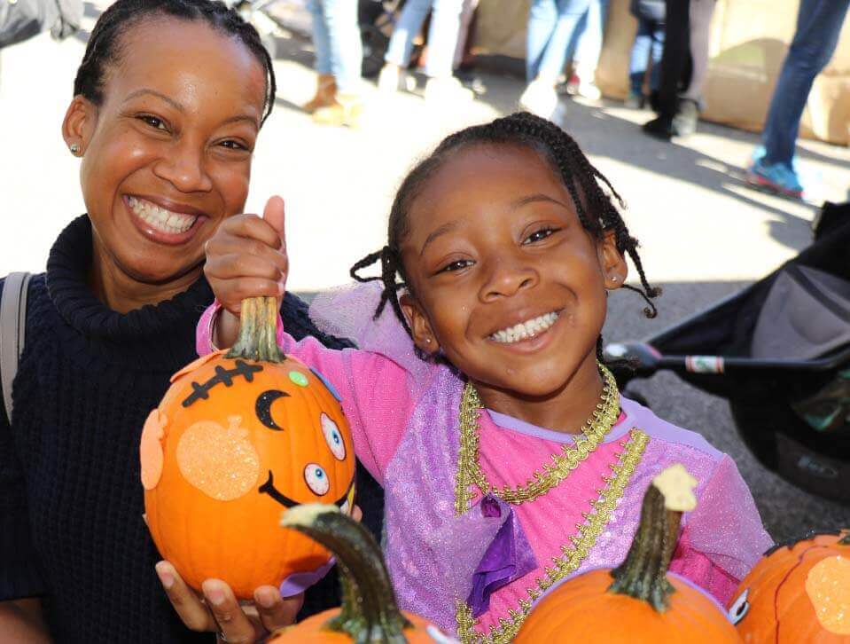 Pumpkin Patch smiling child and parent