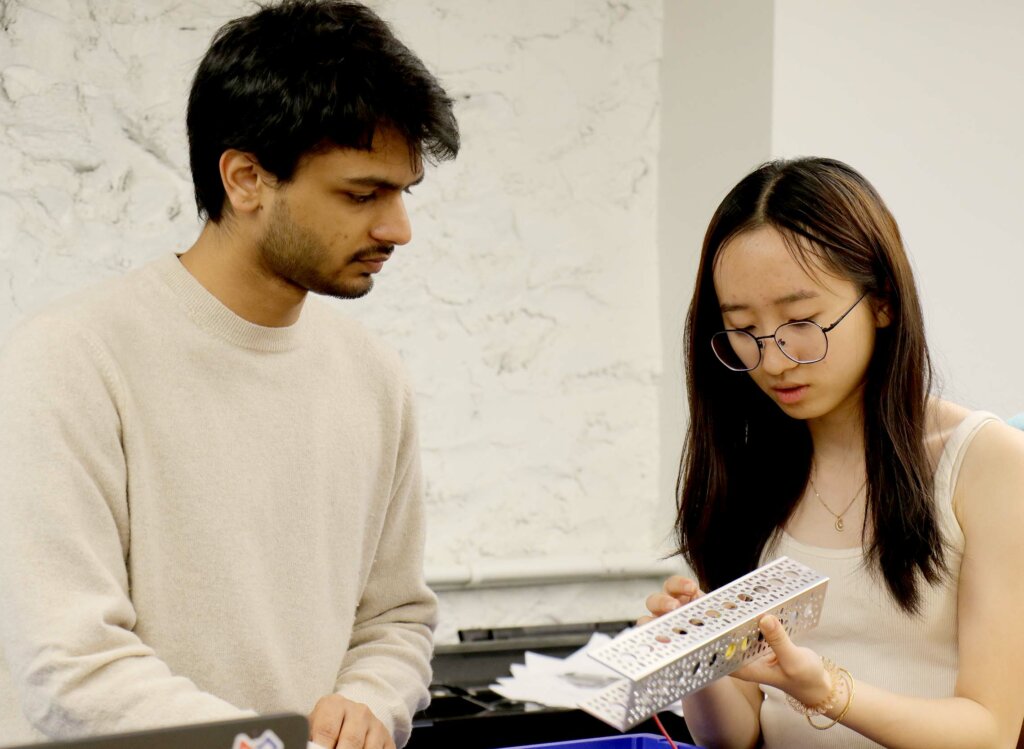 NYU grad student Pankaj Kalve with Tesvara Jiang ’23