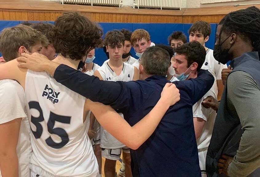 Boys Basketball team huddle