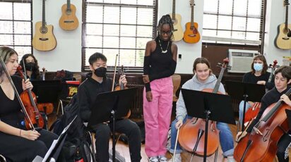 Jordan Millar listens as fellow students rehearse her string composition.