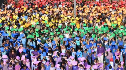 Human solidarity rainbow flag on the oval at Poly Prep