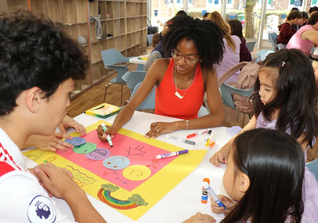 Upper School students working with Lower School Students at Solidarity event at Dyker campus