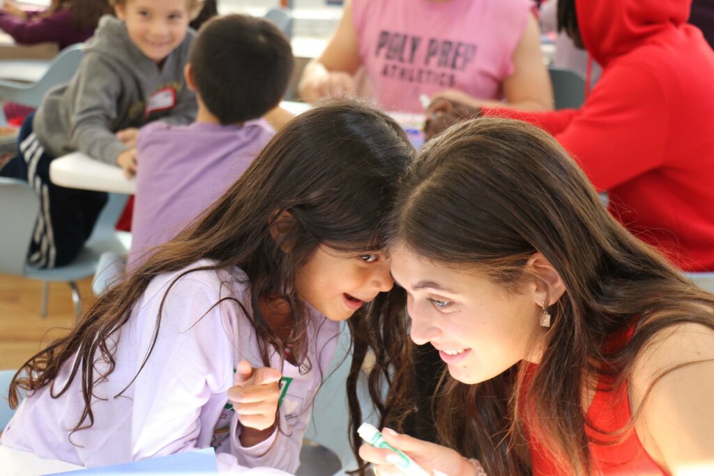 Upper School students working with Lower School Students at Solidarity event at Dyker campus