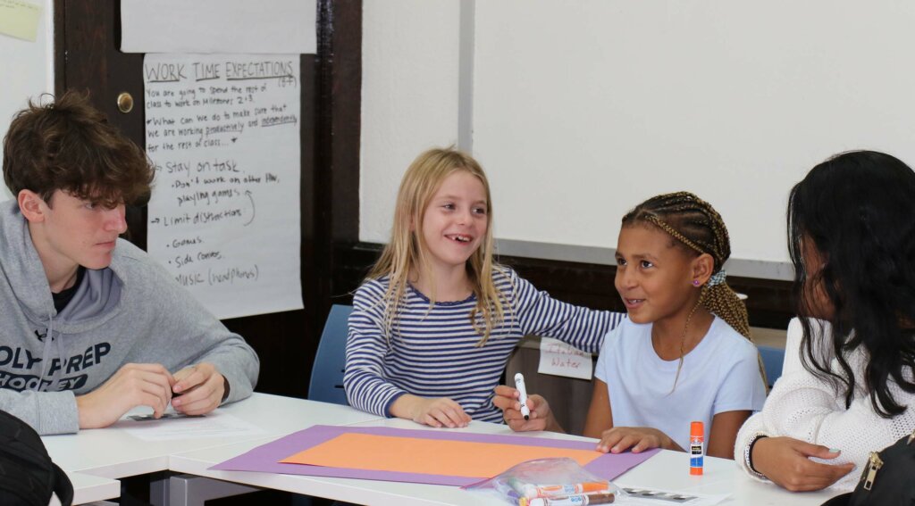 Upper School students working with Lower School Students at Solidarity event at Dyker campus