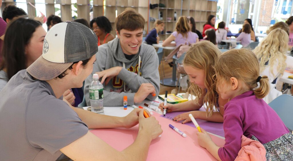 Upper School students working with Lower School Students at Solidarity event at Dyker campus