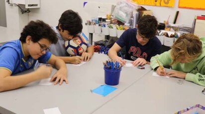 Middle School students work on their mosaic pieces