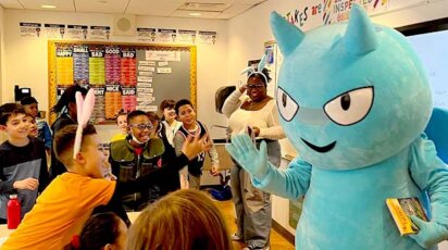 Lower School Blue Devil high-fiving Students