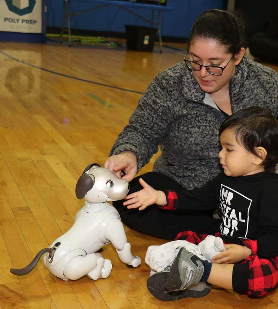 Afternoon of Tech, robot dog with child