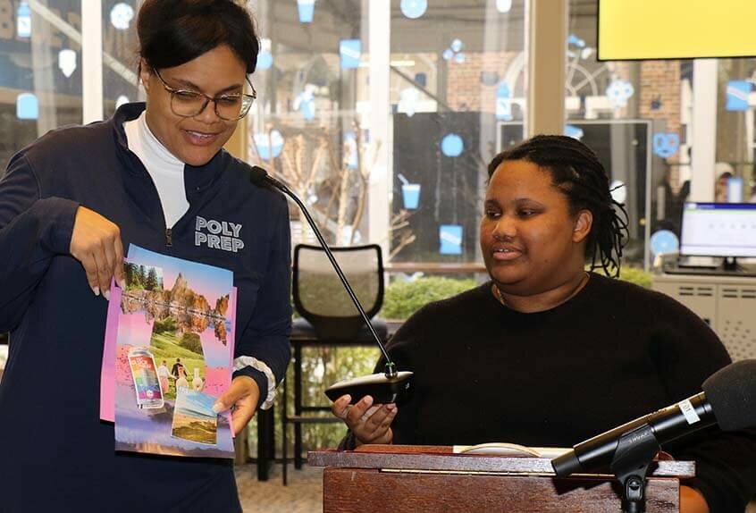 Librarian shows mood board project during visit by Camryn Garrett