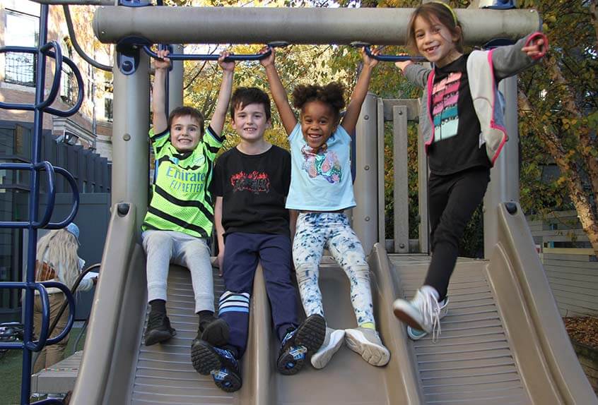 Lower School After School play - children on slide