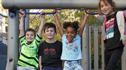 Lower School After School play - children on slide