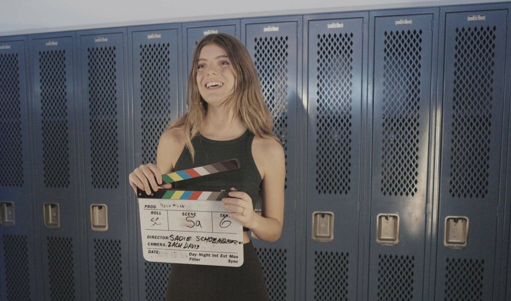 Sadie Schoenberger '25 on set in locker room