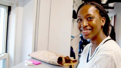 Brianna Sylvain smiling in hallway