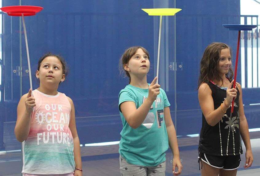 Kids balancing plates at Poly Summer day camp