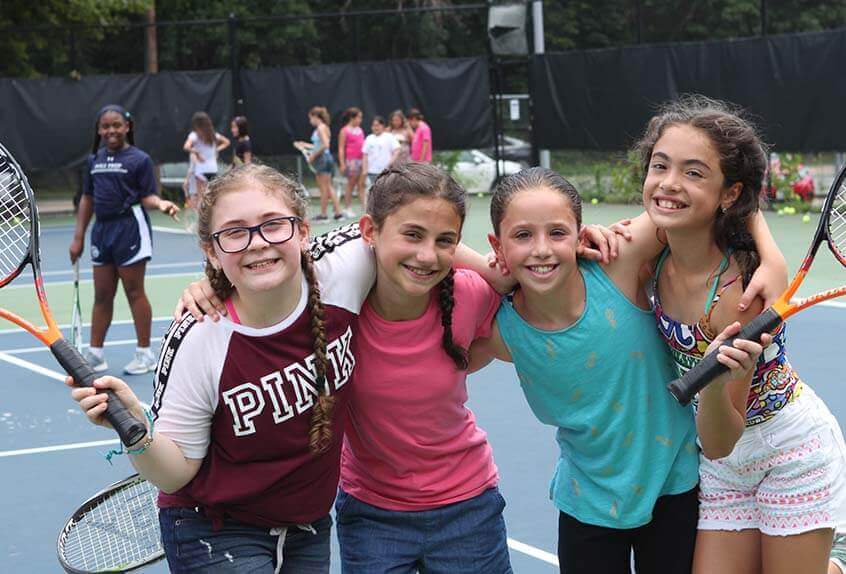 Friends on the tennis court at Poly Summer day camp