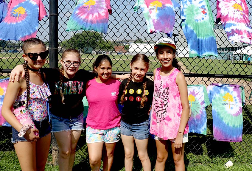 Kids smiling with tie dye shirts at Poly Summer day camp