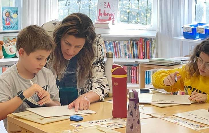 Lower School teacher Marissa Pennington works with student