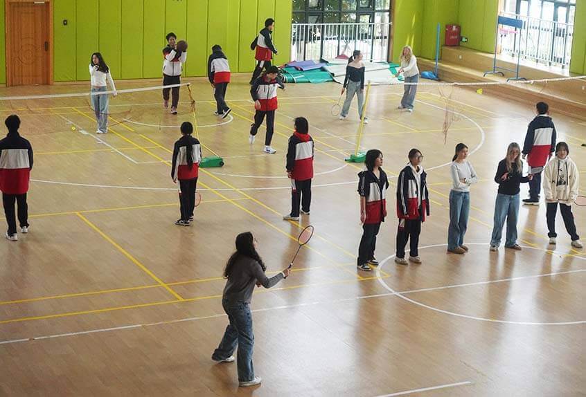 Students play badminton at Xinchuan Foreign Language School