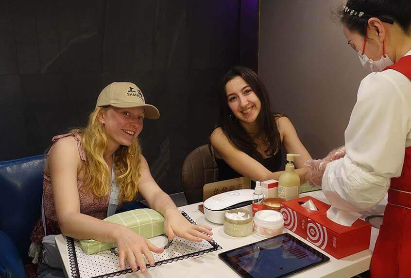 Izzy Leyton '25 and Anna Lisa Di Pietra '25 getting a manicure in Shanghai.