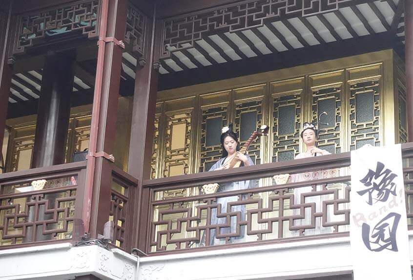 Women play traditional instruments in Yu Garden in Shanghai.