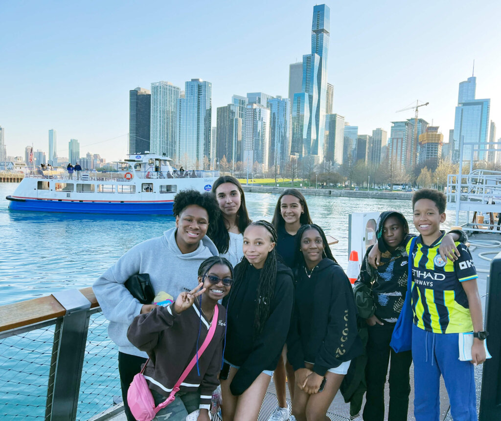 Middle School Chicago trip group skyline with boat
