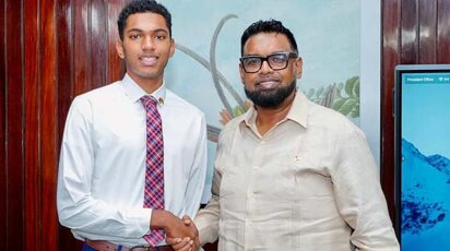 Brandon Willabus and the President of Guyana, Dr. Mohamed Irfaan Ali