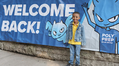 Welcome Back to Poly Prep sign with student