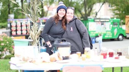 Teachers at Urban Farming table at Homecoming
